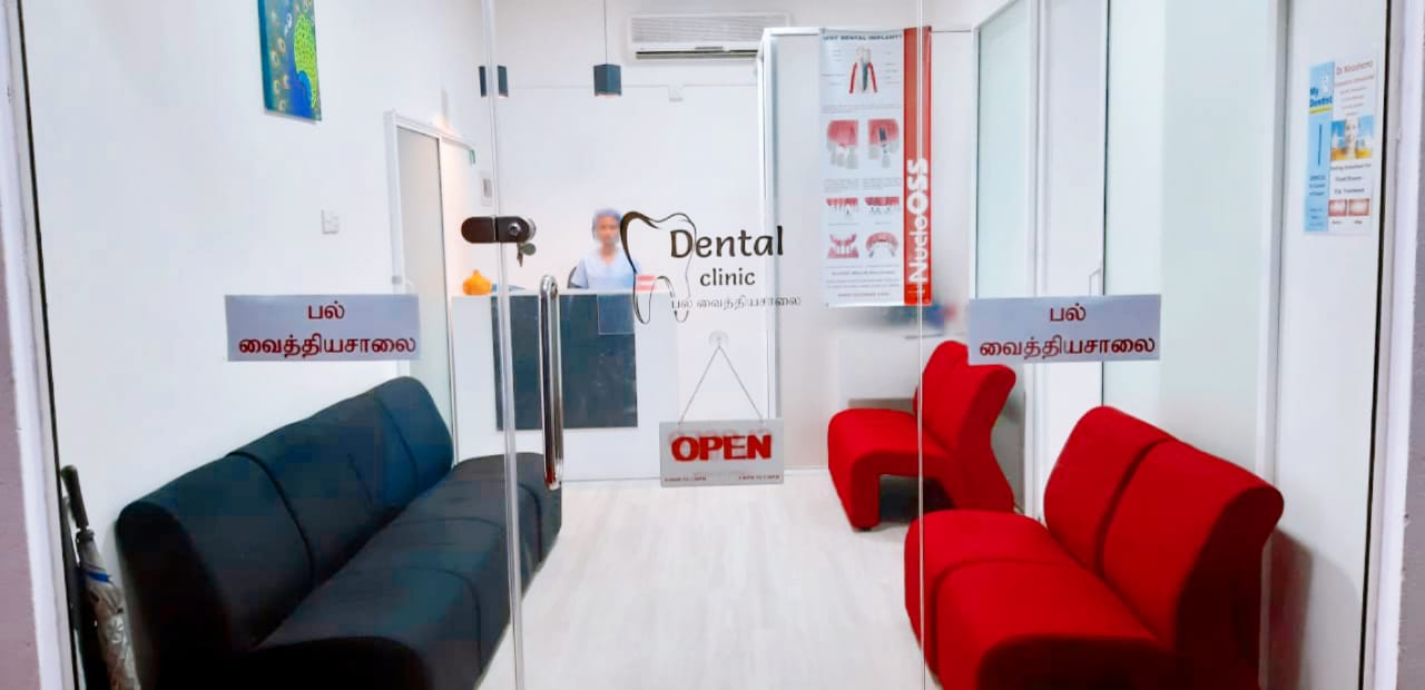 Glass entrance and bright waiting area with red and dark blue seating